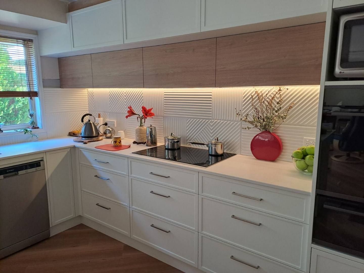 White Kitchen With Wooden Accents, Backsplash Lighting — David Son Tiling in Springdale Heights, NSW