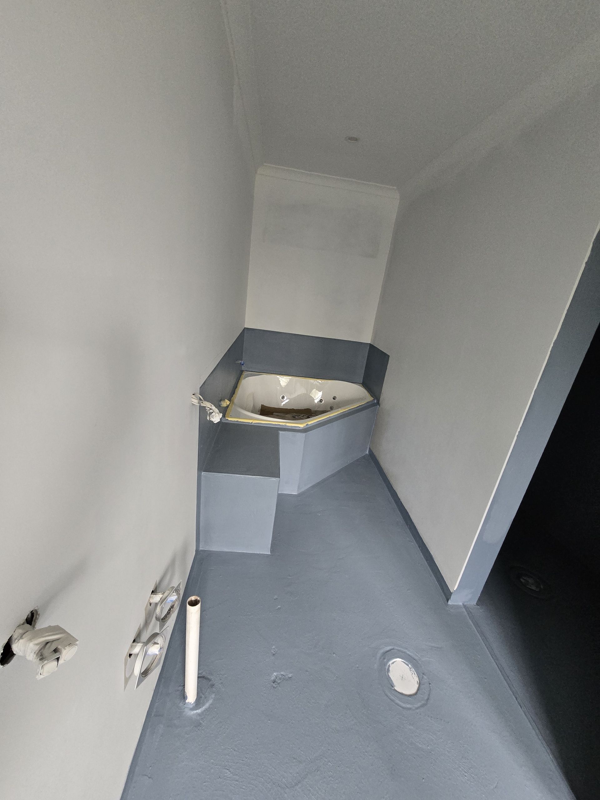 Bathroom Under Renovation; Herringbone Tilework Underway — David Son Tiling in Springdale Heights, NSW