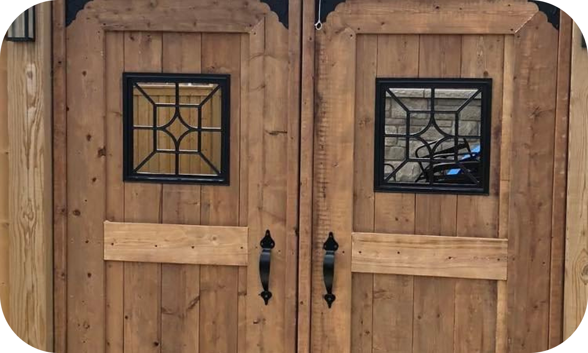 A pair of wooden doors with stained glass windows