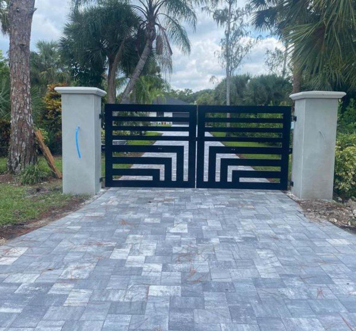 A black and white gate with a geometric design on it