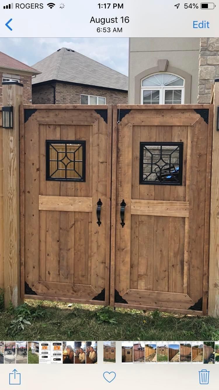 A picture of a wooden gate on a cell phone.