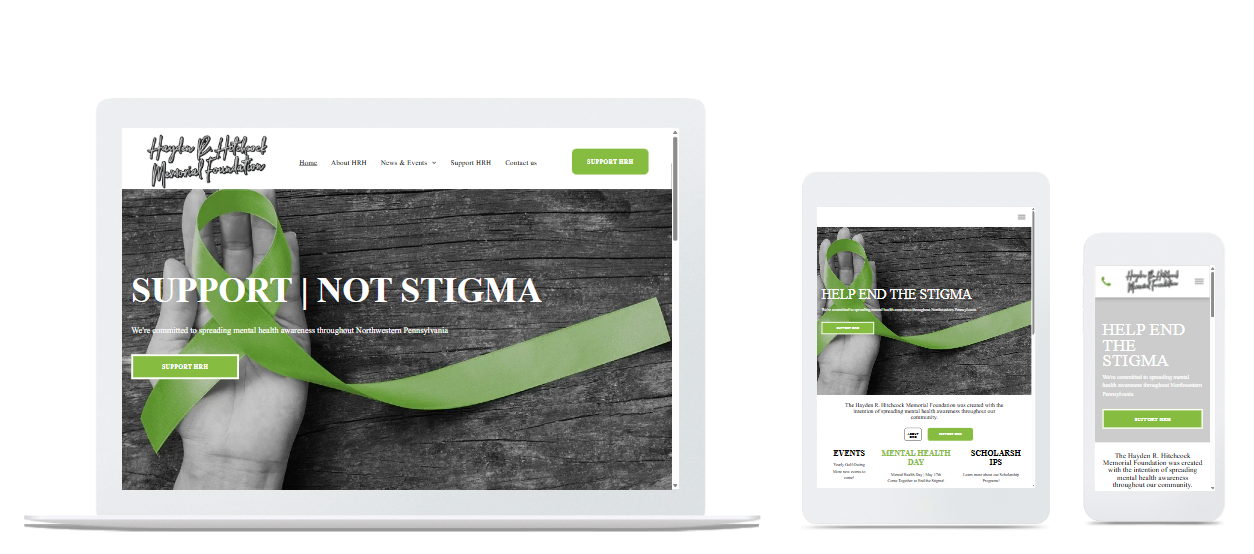 Laptop, tablet, and phone displaying a website with a green ribbon and the words 