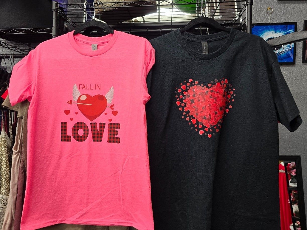A pink and a black t-shirt that says love