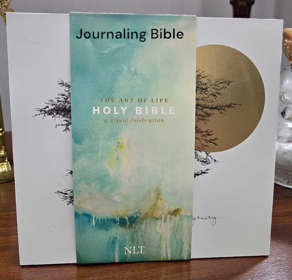 The holy bible and the book of mormon are on a wooden table