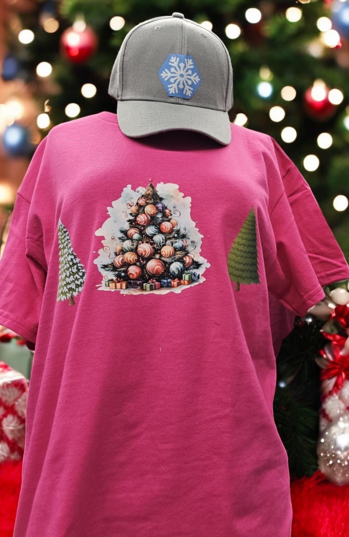 A pink t-shirt with a christmas tree on it