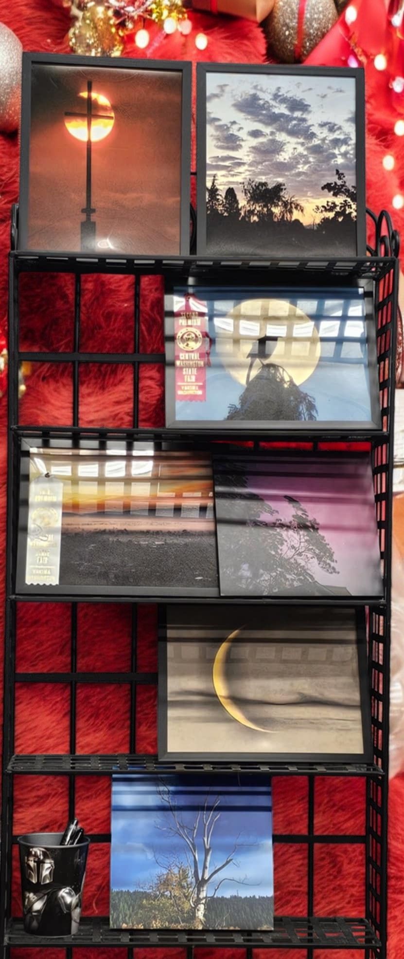 A shelf with a bunch of pictures on it