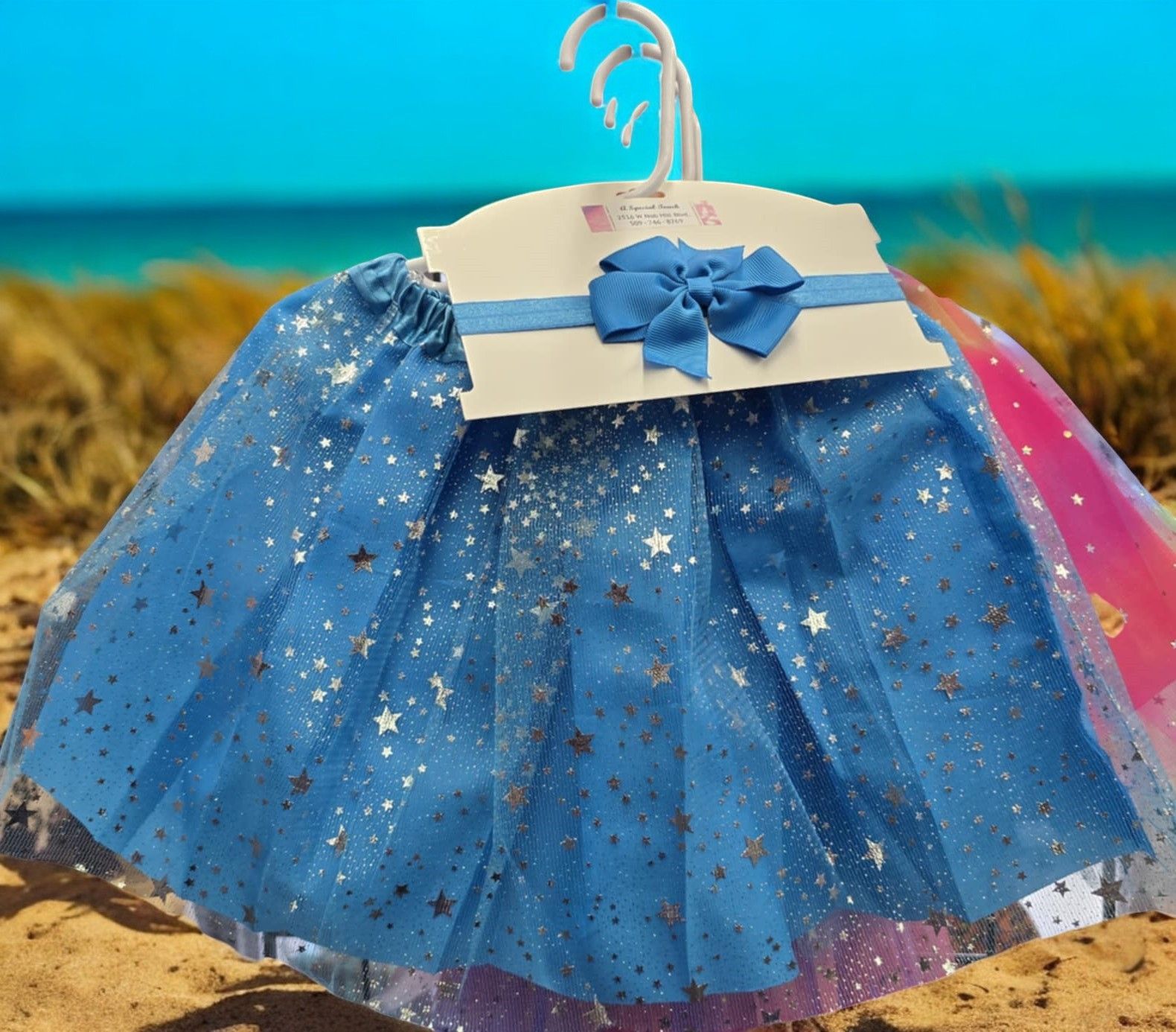 A blue tulle skirt with gold stars and a blue bow