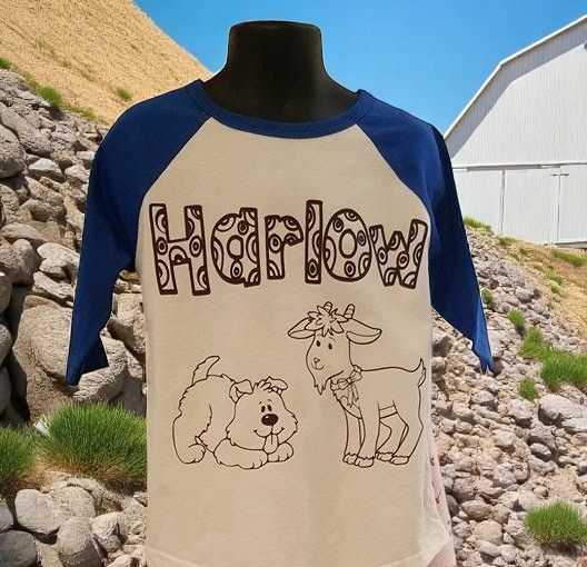 A harlow shirt with a dog and a goat on it