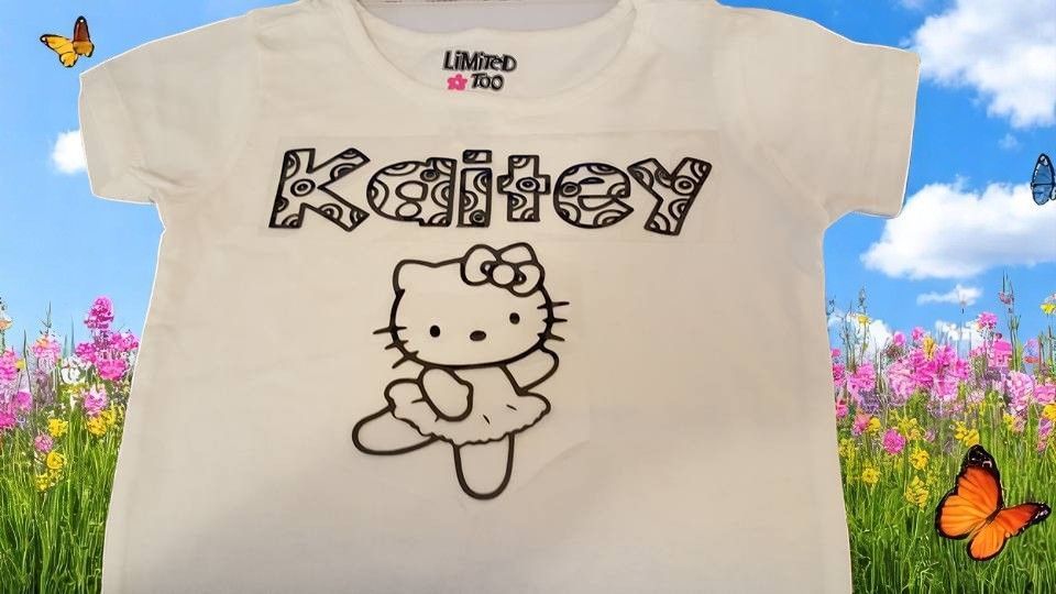 A hello kitty t-shirt with the name kaity on it