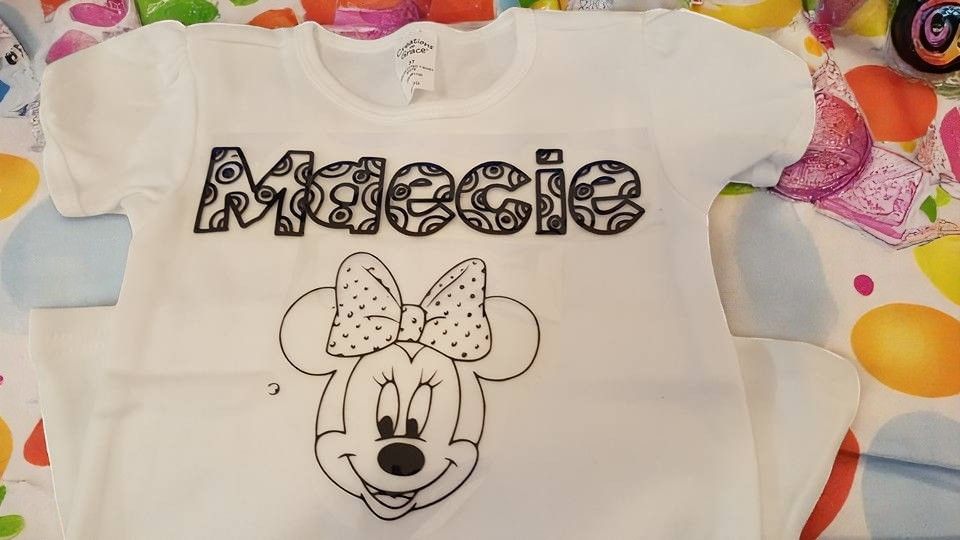 A white t-shirt with the name maecie and minnie mouse on it