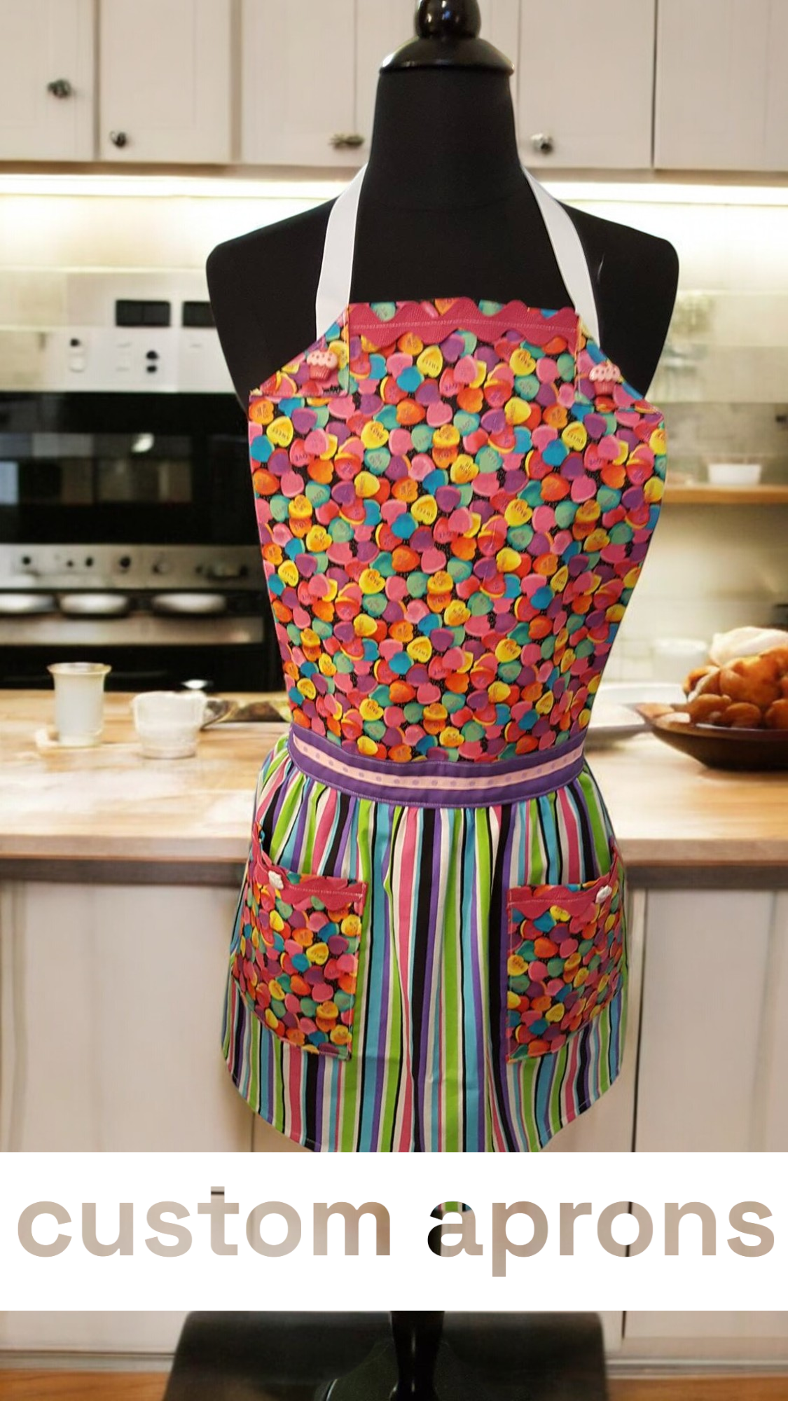 A colorful apron is on a mannequin in a kitchen
