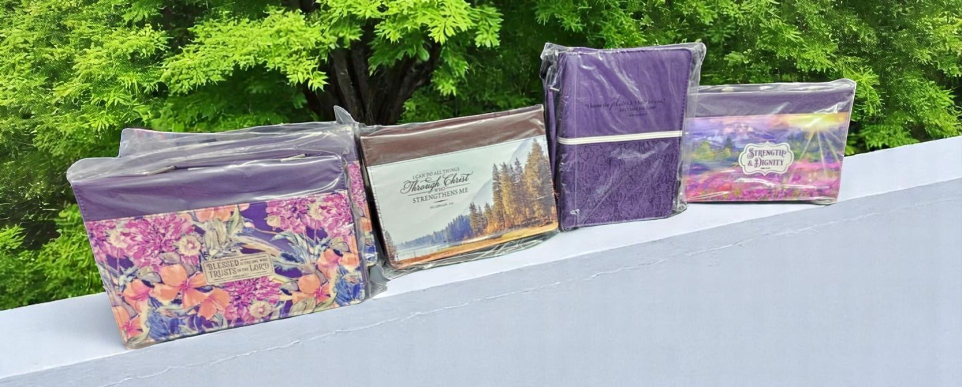 A row of boxes sitting on top of each other on a sidewalk.