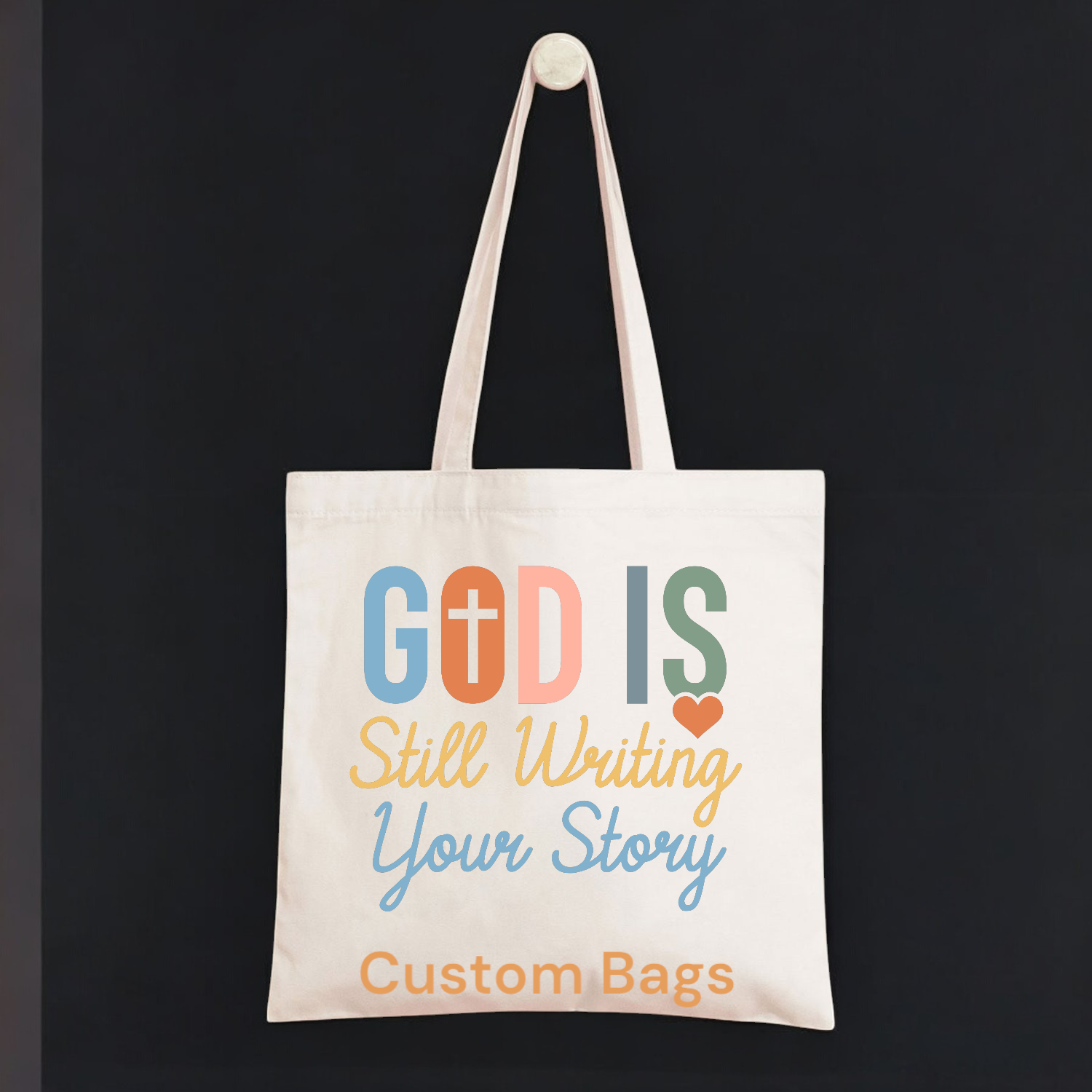 A tote bag that says god is still writing your story