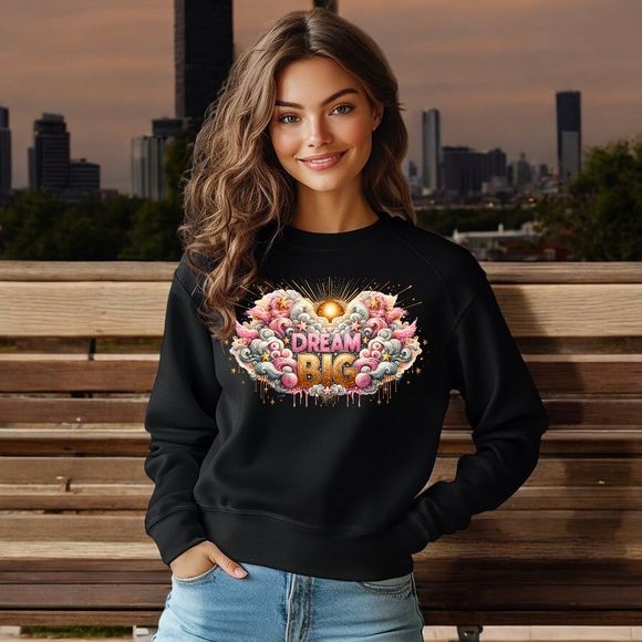 A woman wearing a black sweatshirt is sitting on a wooden bench.
