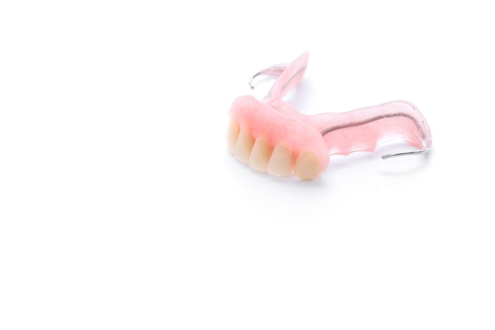 A Close Up Of A Denture On A White Background — Buderim Denture Studio In Buderim, QLD