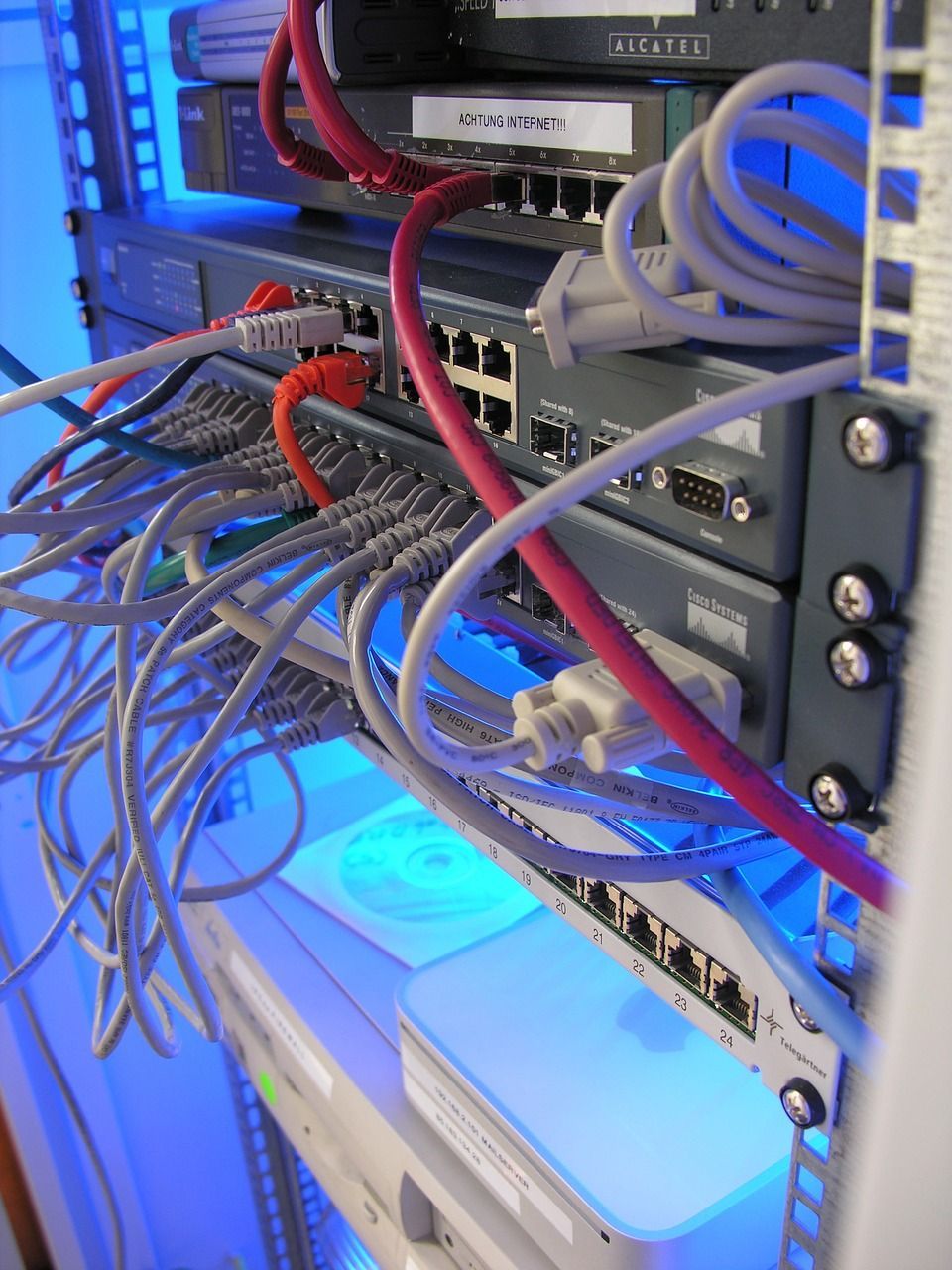 Image of a network router with wires plugging in to it