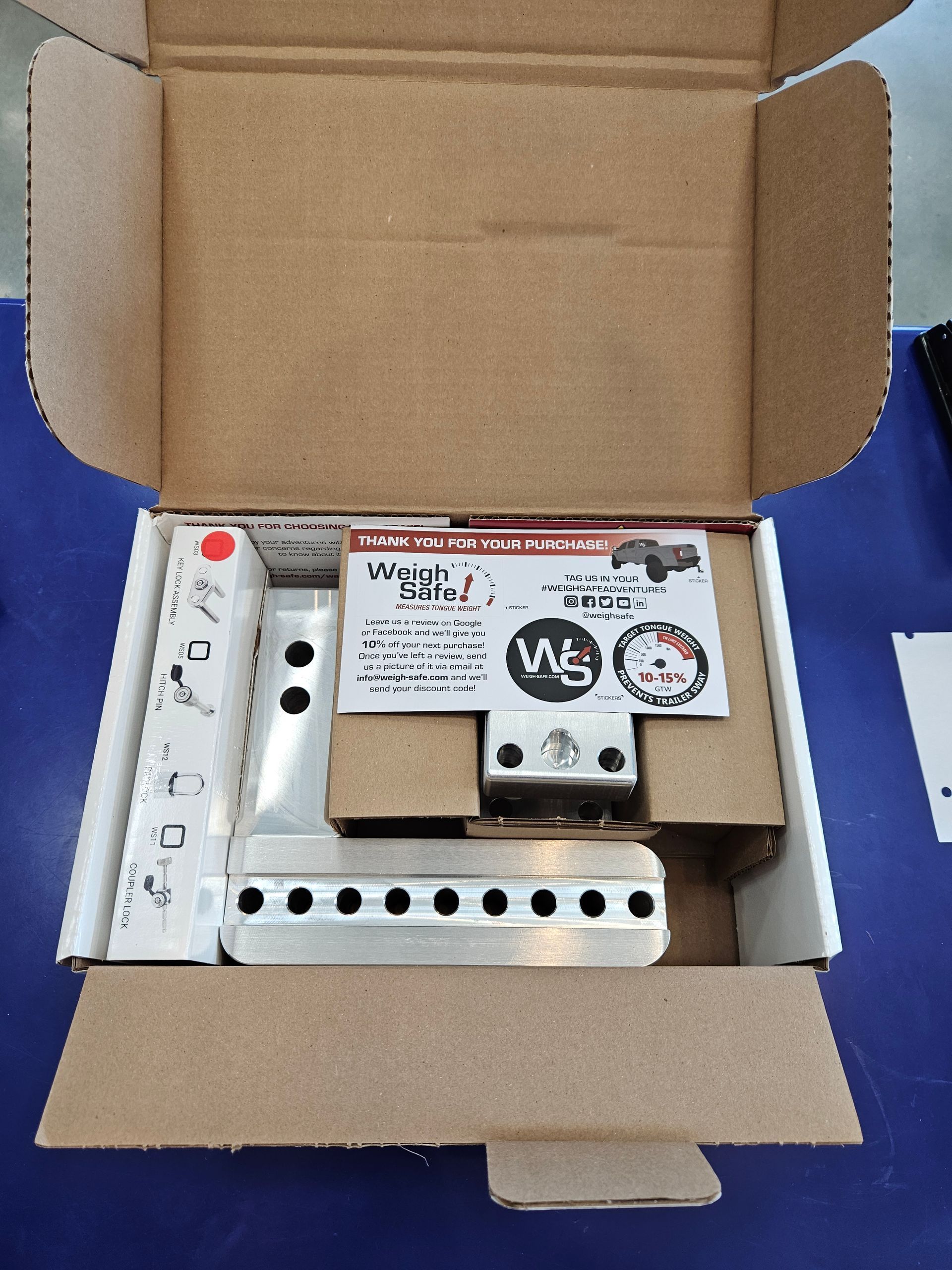 A cardboard box with a piece of equipment inside of it
