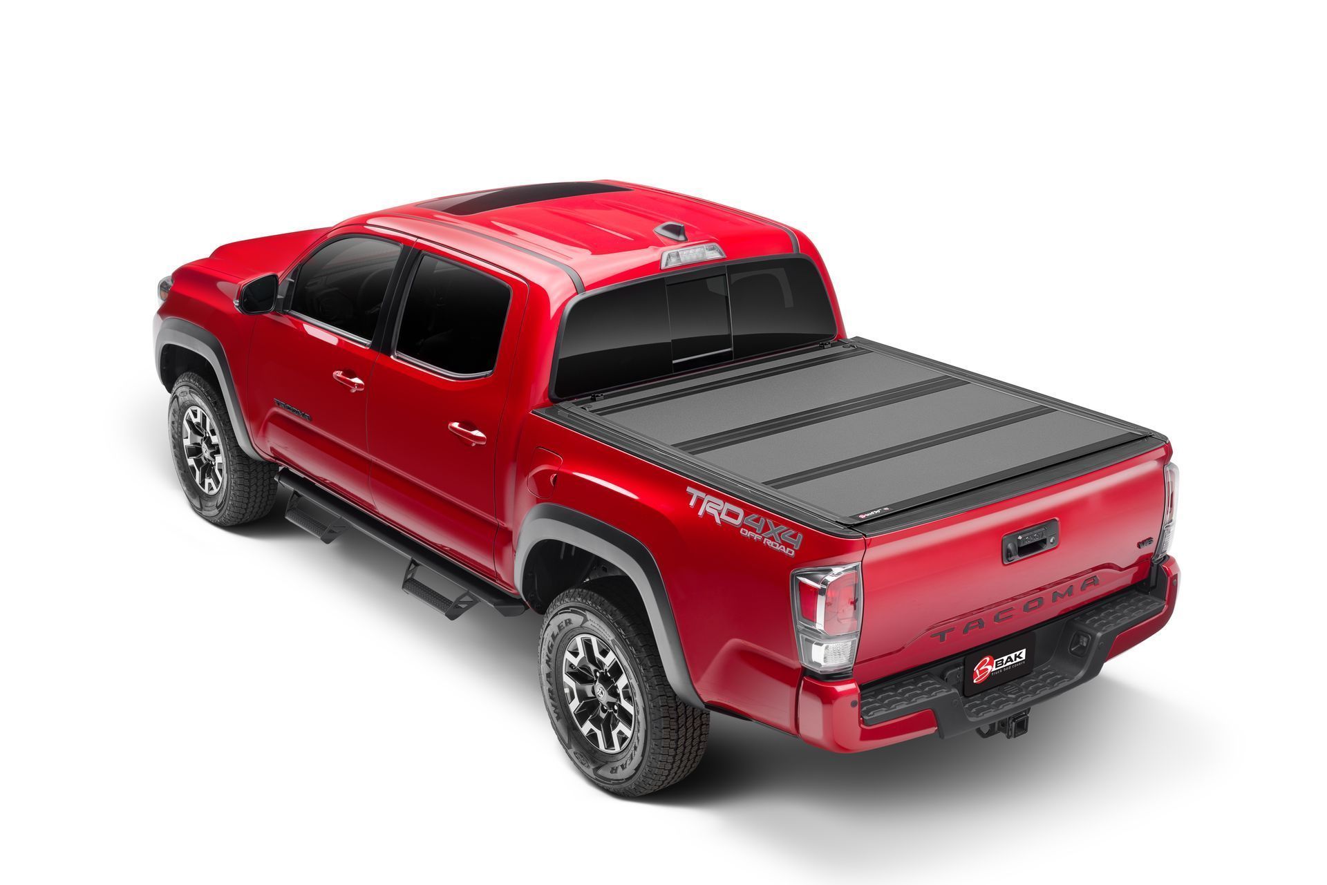 A red toyota tacoma truck with a black bed cover on a white background.