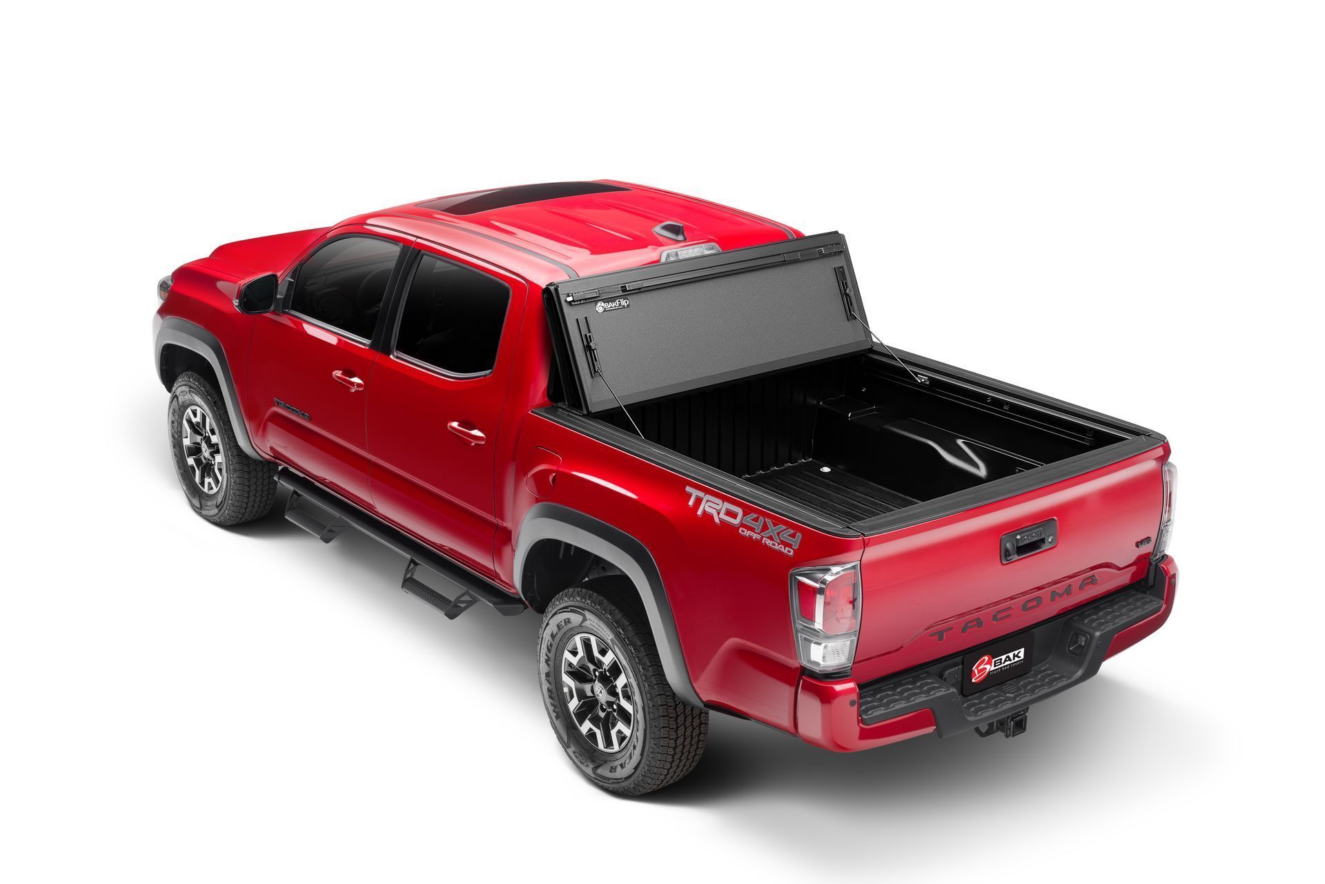 A red truck with a black bed cover on a white background.
