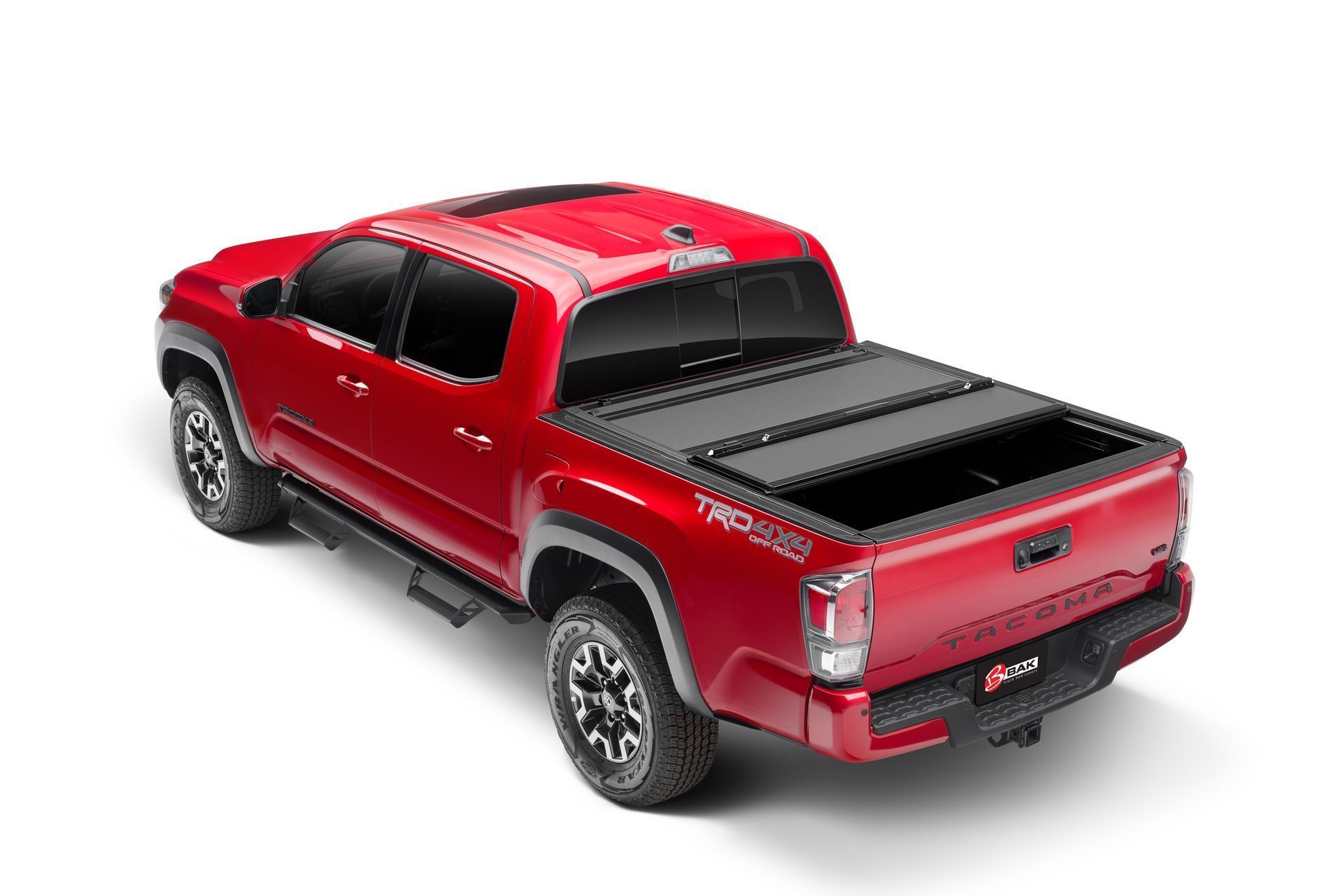 A red truck with a black bed cover on a white background.