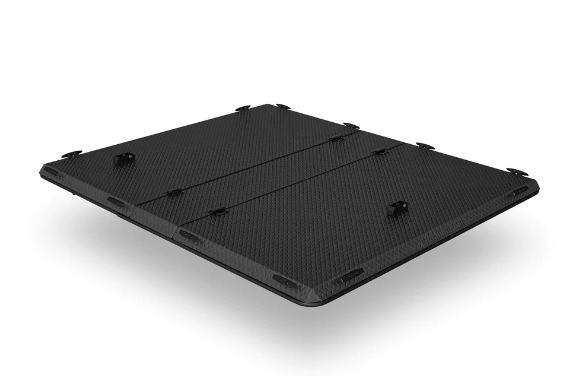 A black box is sitting on a white surface.