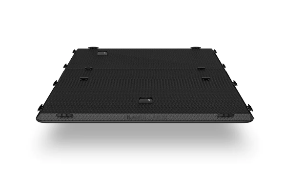 A black box is sitting on a white surface.