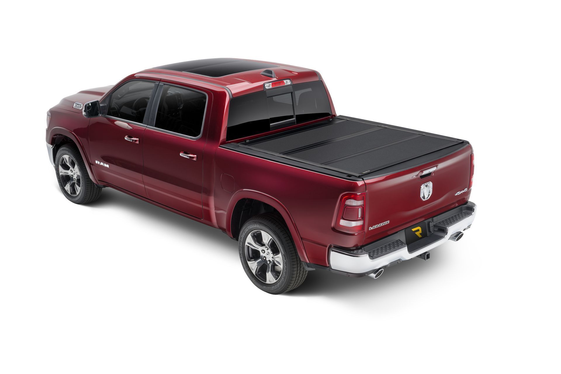 A red dodge ram truck with a black bed cover on a white background.