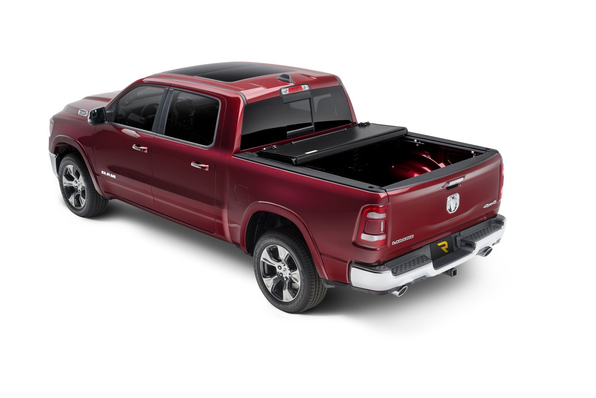A red dodge ram truck with a black bed cover on a white background.