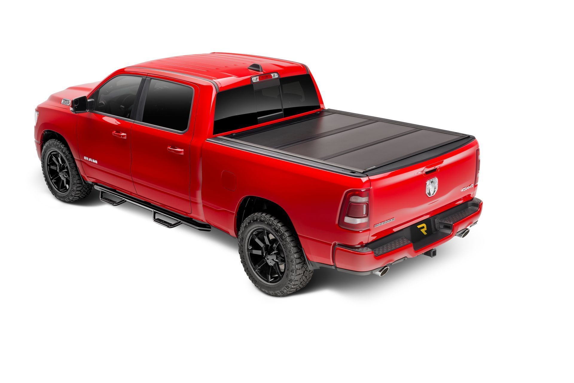 A red dodge ram truck with a black bed cover on a white background.