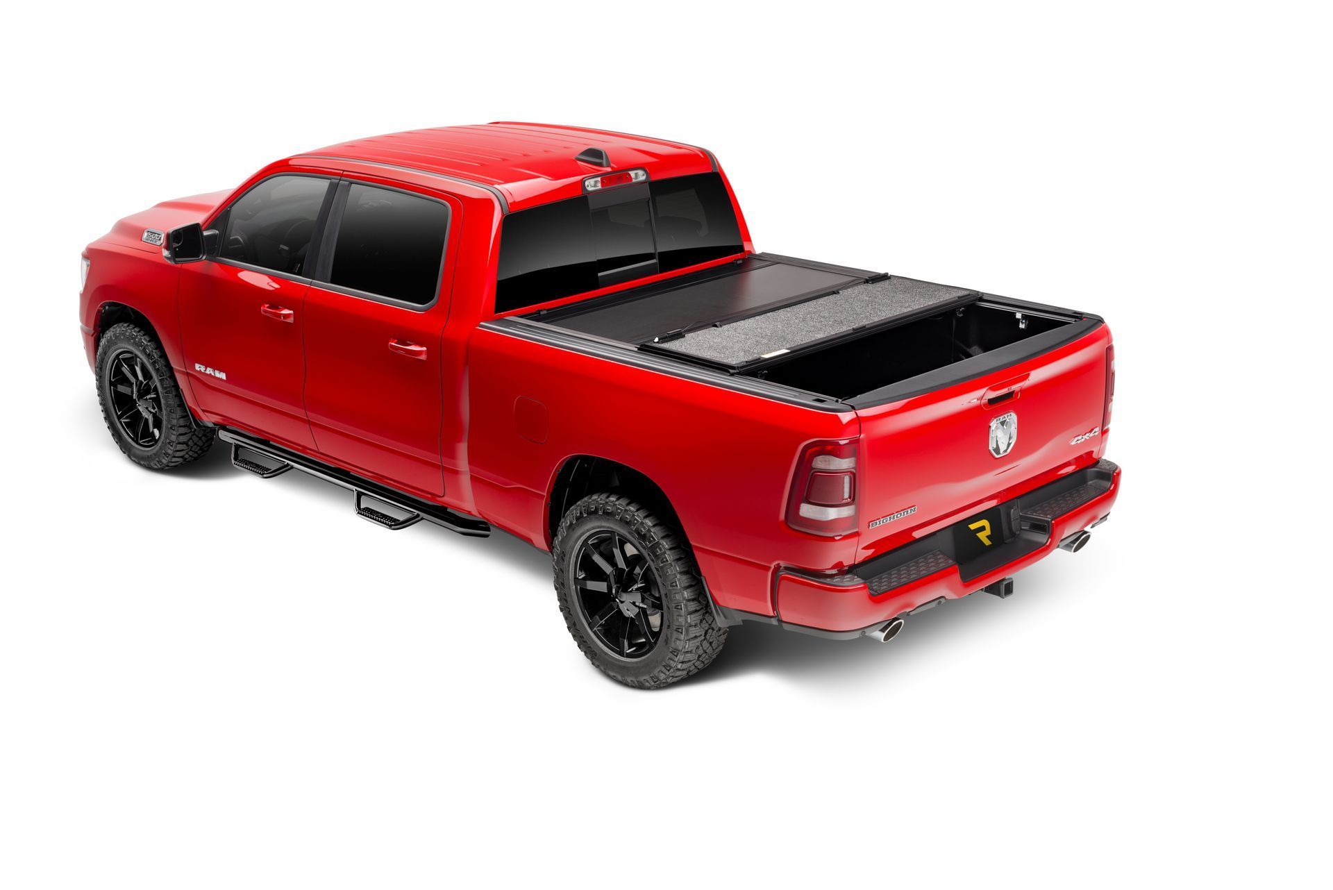 A red dodge ram truck with a black bed cover on a white background.