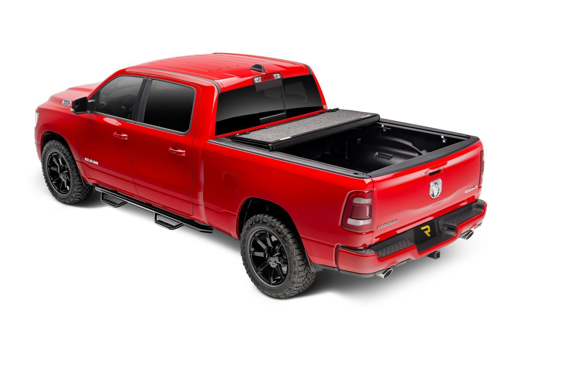 A red dodge ram truck with a black bed cover on a white background.
