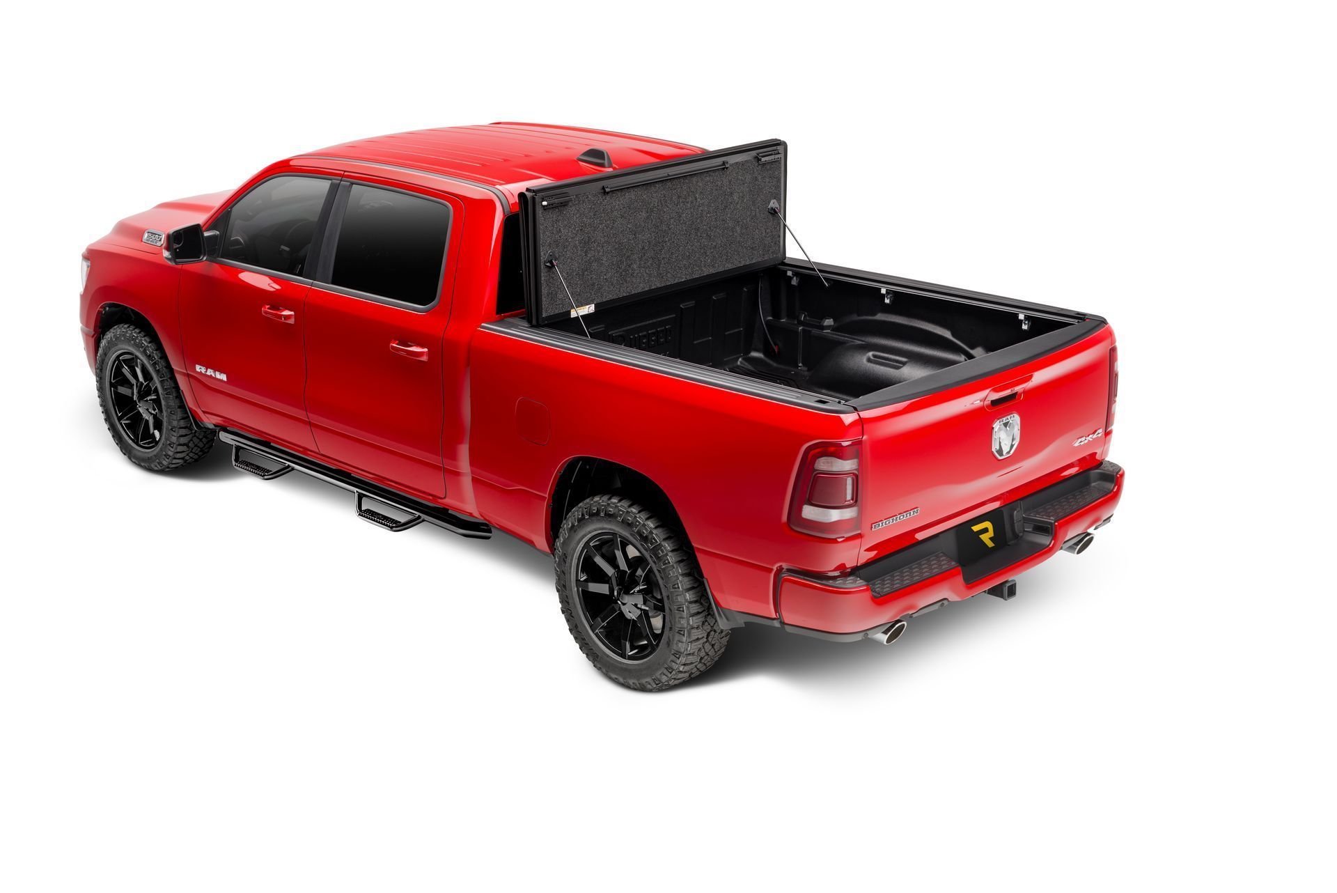 A red dodge ram truck with a black bed cover on a white background.