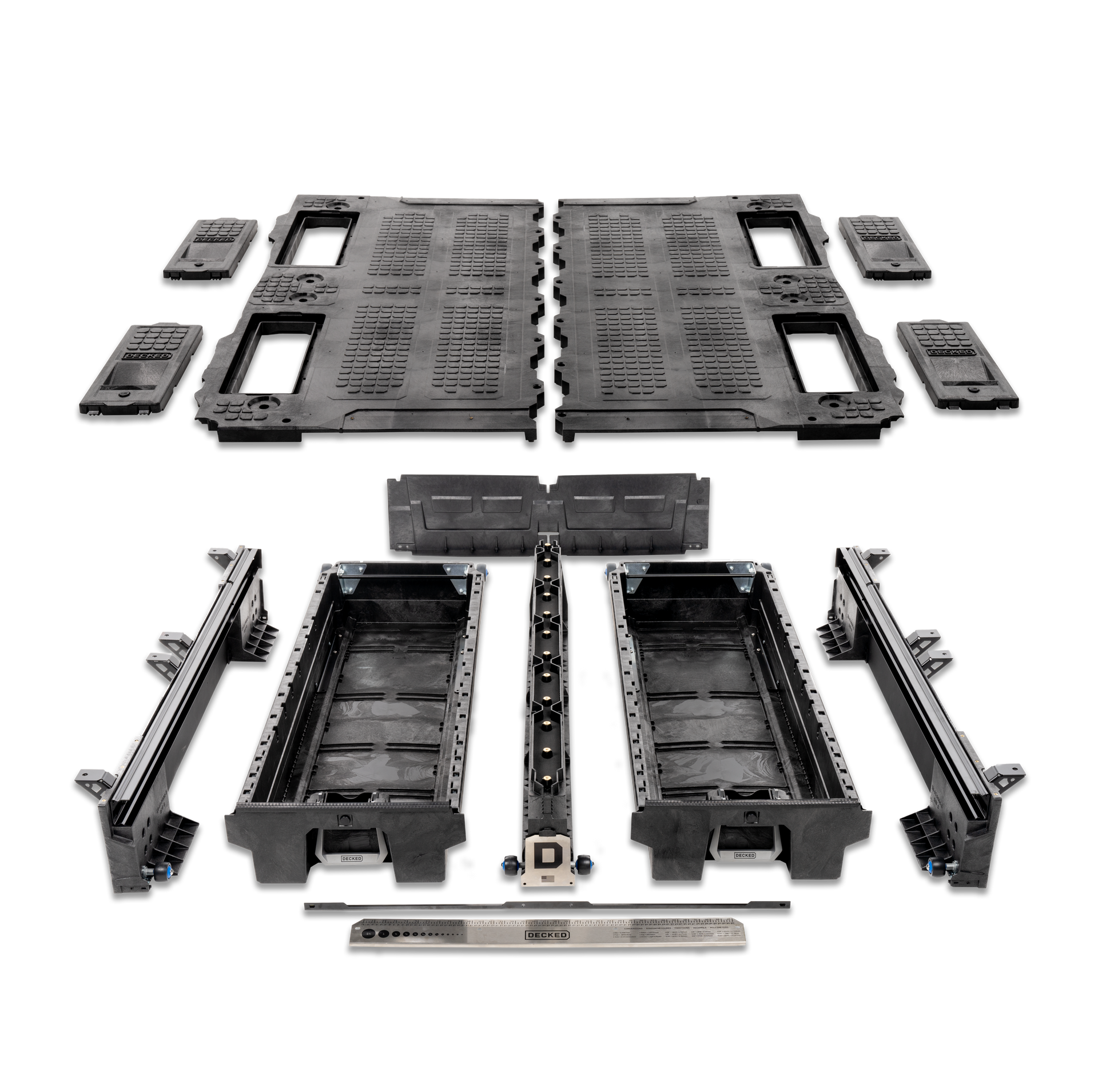 A bunch of black plastic pieces are sitting on top of each other on a white surface.