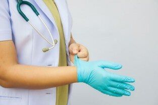 Doctor wearing gloves - Surgery in Hattiesburg, MS