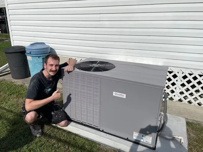 Mr. Moustache next to an installed HVAC system