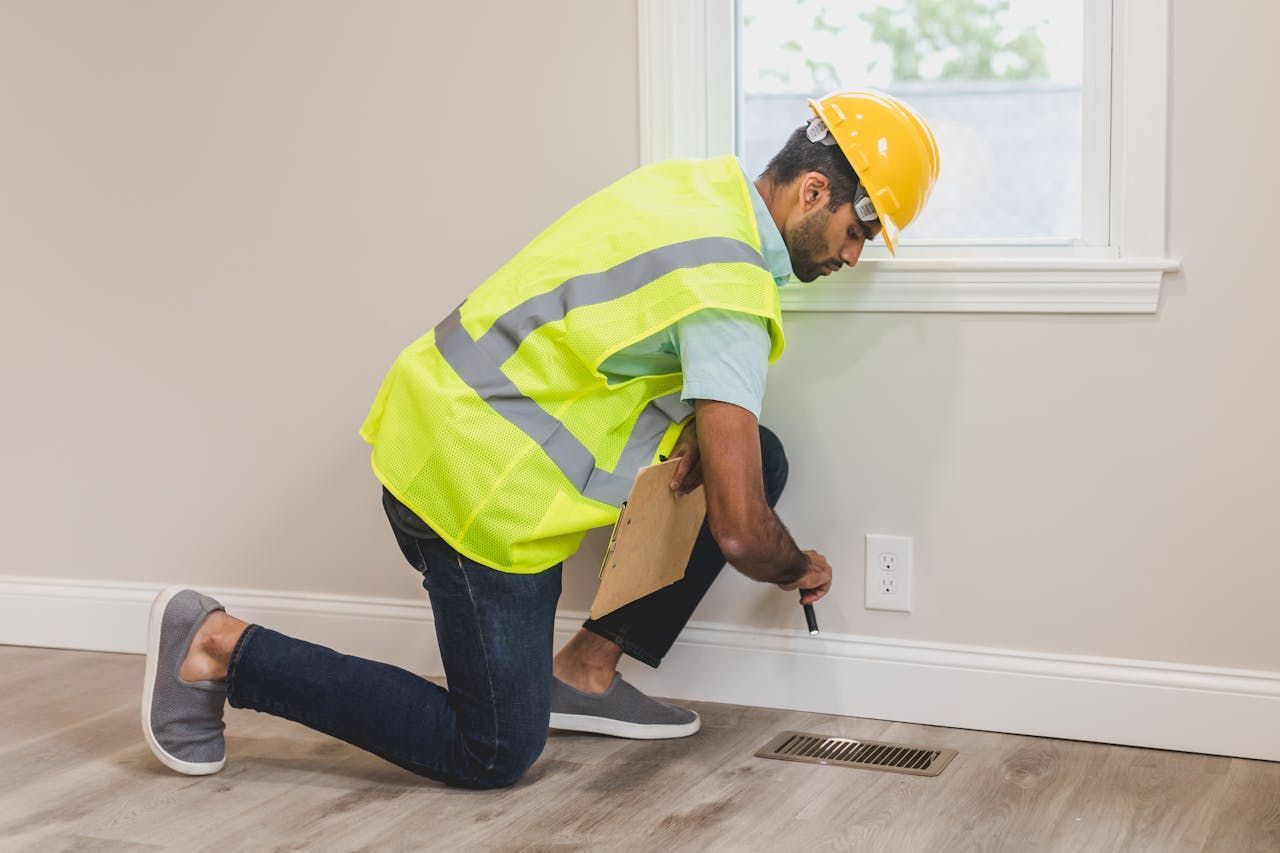 An AC contractor inspecting in Holiday, FL