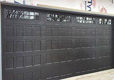 NEW LARGE DARK DOOR INSTALLATION IN PROGRESS - garage doors in Bozeman, MT