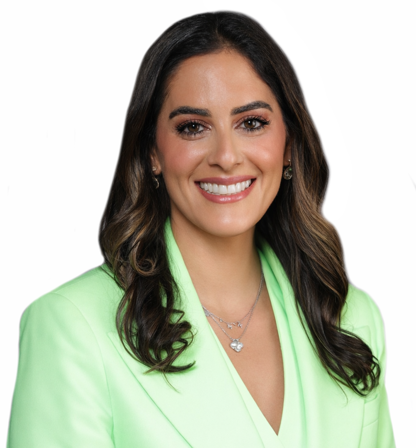 Woman in black scrubs, smiling with arms crossed.