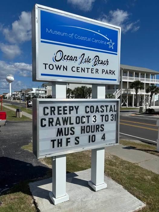 A sign for the ocean isle beach town center park
