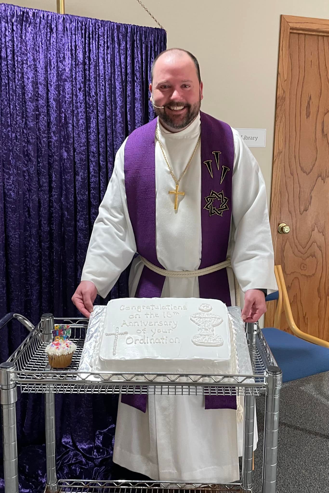 Pastor Jon Yurk with an anniversary cake