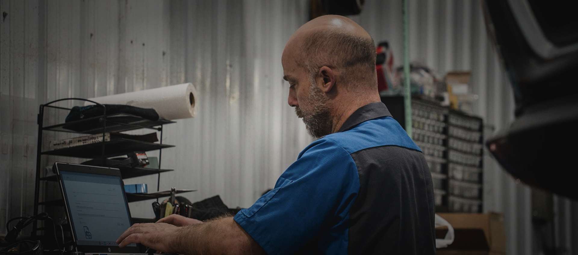 mechanic working on computer | Priced Right Auto