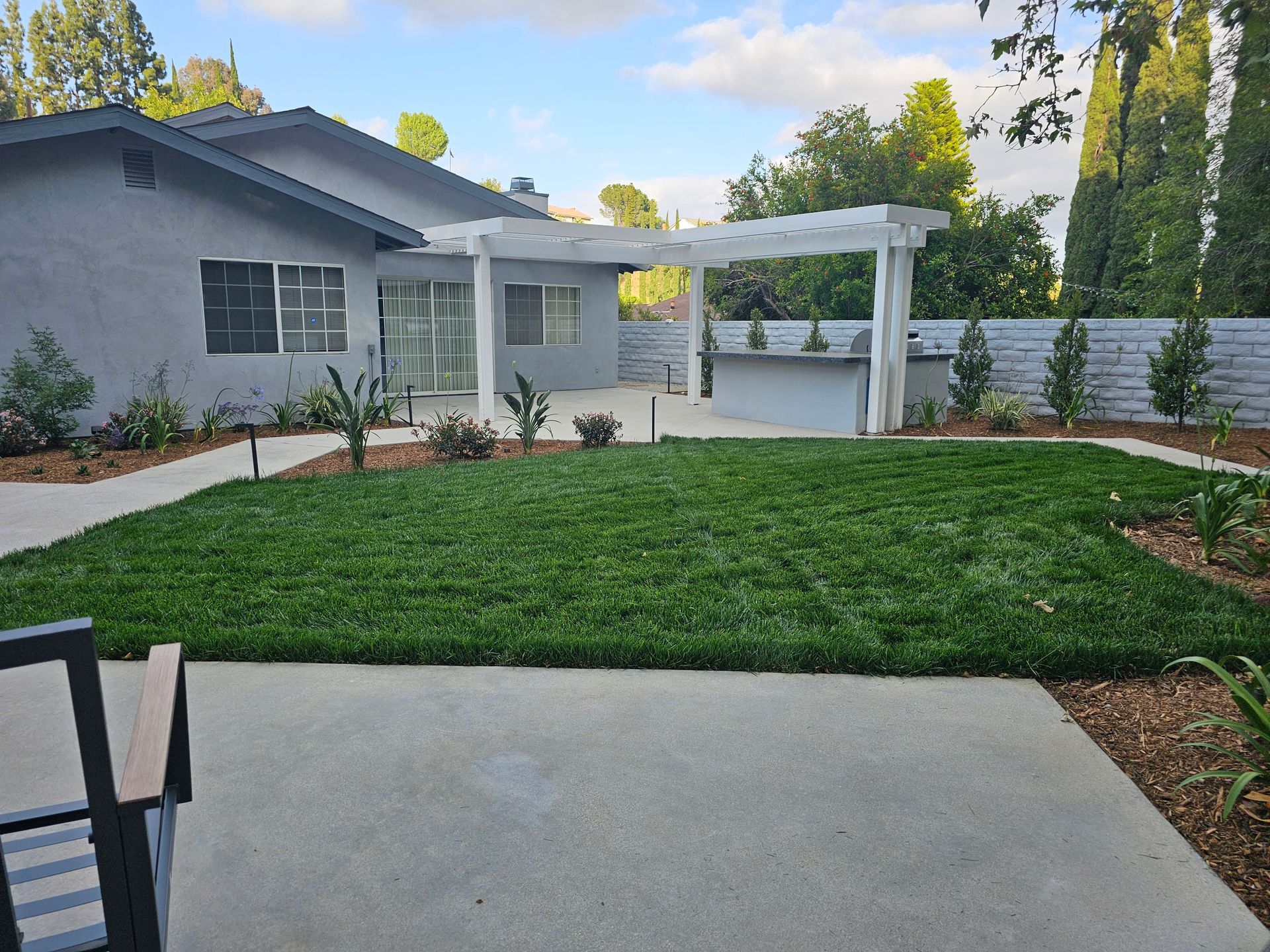 A house with a large lawn in front of it