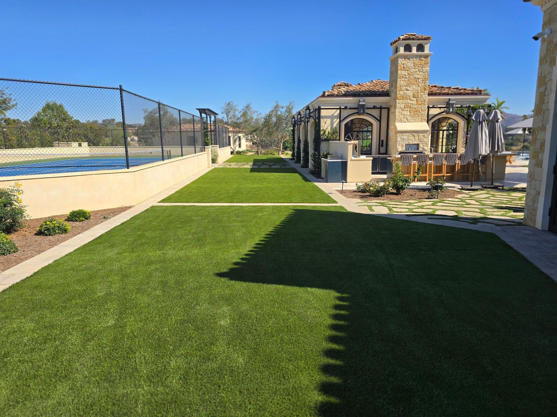 A large house with a large lawn in front of it