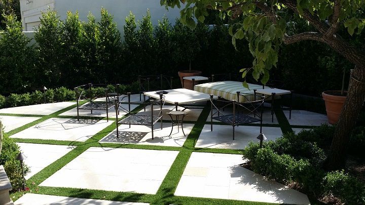 A patio with a table and chairs in it