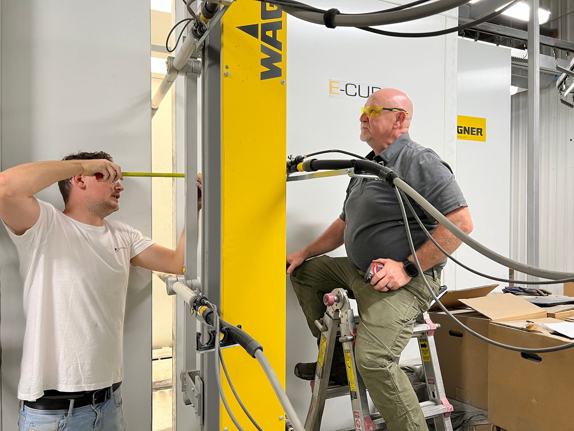 Two men are working on Combined Finishing pumps