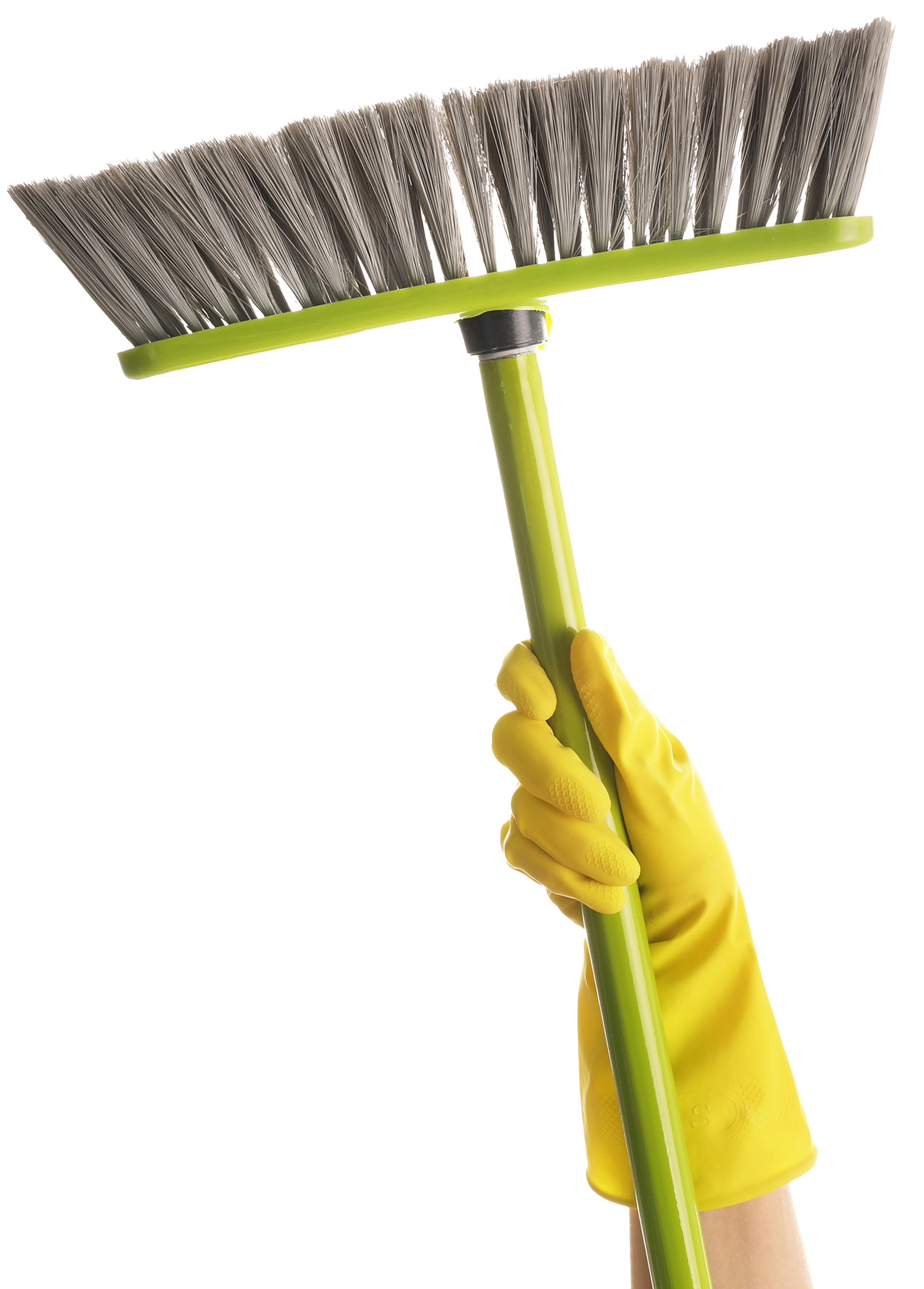 Hand in yellow rubber glove holding a green-handled broom.