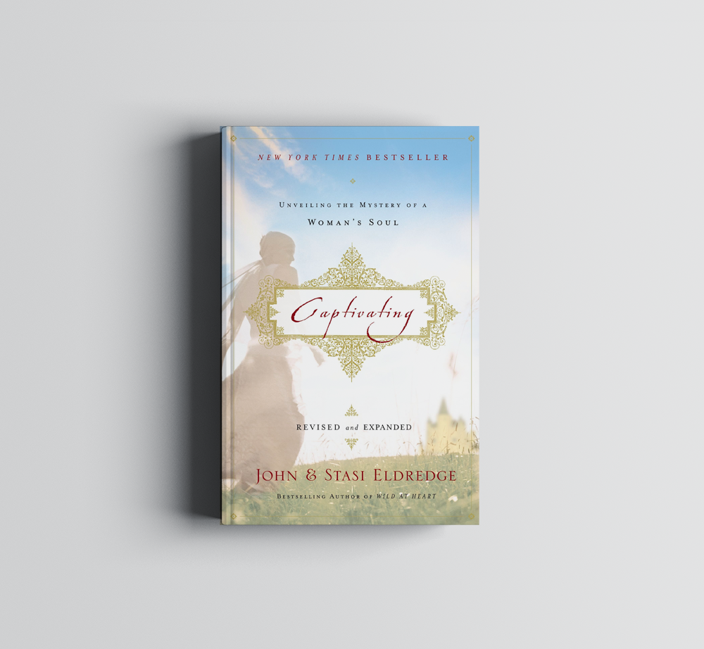 A book by John & Stasi Eldredge is sitting on a table