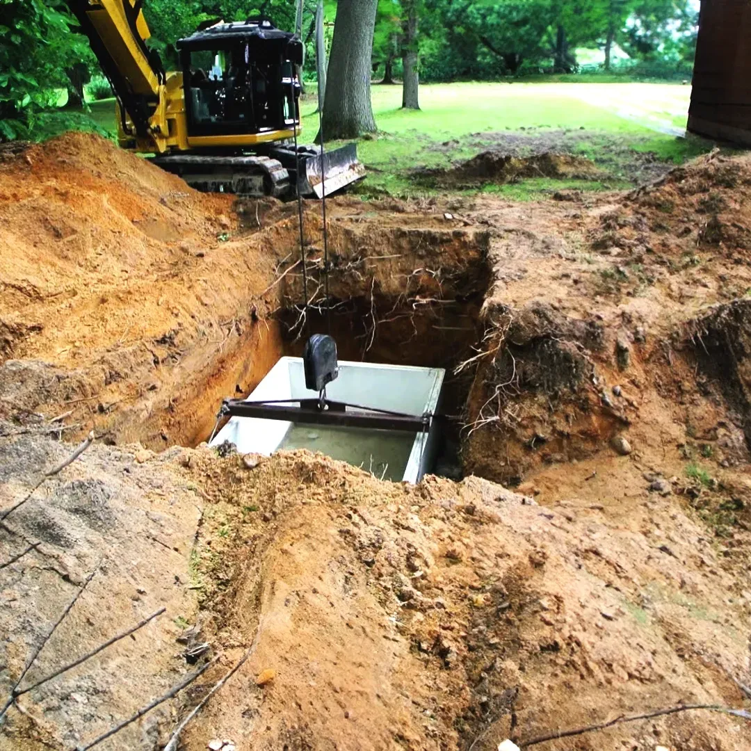 A professional septic tank installation in progress, providing a  solution for your Fredericksburg, Virginia property