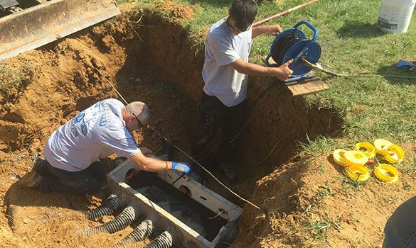 Drainfield Solutions team performing a septic repair on-site