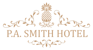 Logo for P.A. Smith Hotel featuring a gold pineapple graphic with elegant scrollwork on a white background.